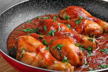 Frying pan with chicken cacciatore, closeup