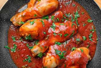 Frying pan with chicken cacciatore, closeup