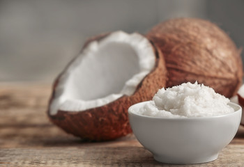 Fresh coconut oil in bowl on wooden table