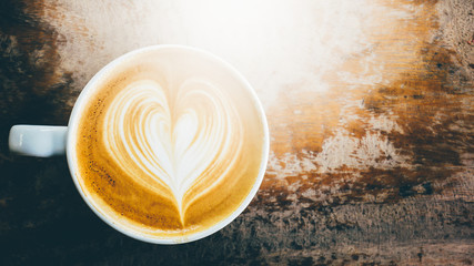 Coffee cup in coffee shop - vintage style effect picture