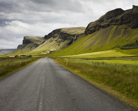 Iceland, Sudurland, Road passing by Foss a Sidu waterfall