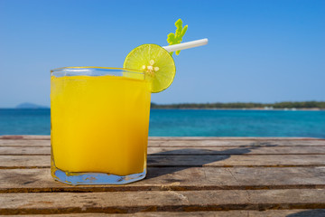 pine apple juice cocktail on wood texture for summer time - can use to display or montage on product
