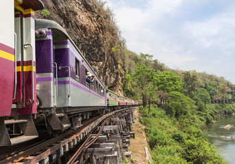 Obraz premium passenger thai train moving on death of railway between tham krasae railway station river kwai kanchanaburi Thailand