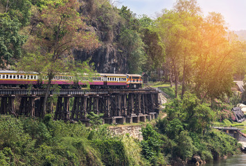 Fototapeta na wymiar passenger thai train moving on death of railway between tham krasae railway station river kwai kanchanaburi Thailand