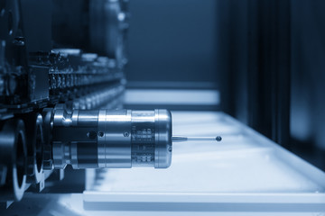 The measurement probe for measure the sample part on the CNC machine in the dark scene