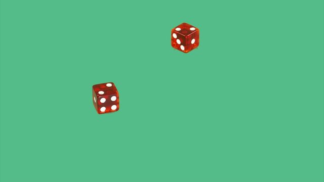 Red dice on green screen