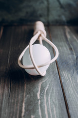 Wooden Whisk and Egg on wooden kitchen table. Bake concept