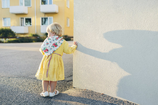 Sweden, Blekinge, Karlskrona, Girl (2-3) leaning against wall