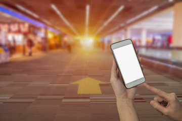 Hand holding mobile phone with white screen