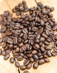 roasted coffee beans on wooden table