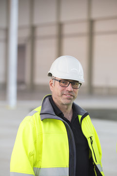 Sweden, Portrait of man wearing reflective jacket and helmet