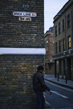 UK, England, London Shoreditch, Man walking on street