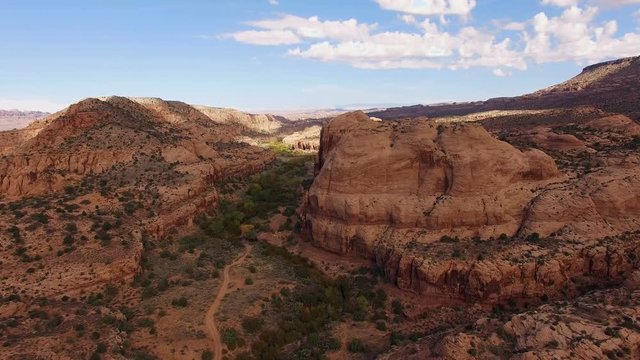 Slow moving drone toward red rocks