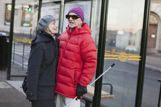 Sweden, Stockholm, Sodermalm, Senior couple waiting at bus stop