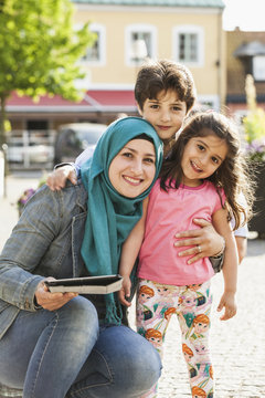 Sweden, Blekinge, Solvesborg, Portrait of mother with son (6-7) and daughter (4-5)