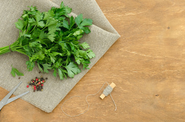 Bunch of parsley is on linen napkin