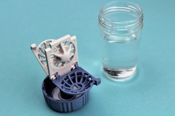 An Image of a contact lens case - Background blurry