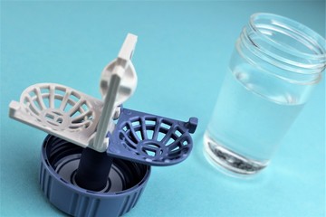 An Image of a contact lens case - Background blurry