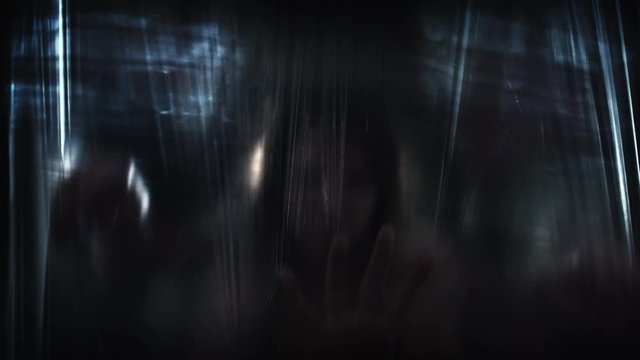 4K Horror Shot Of Creature Hands on Plastic Curtain