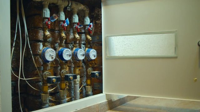 Box with water meter devices in new built residential house