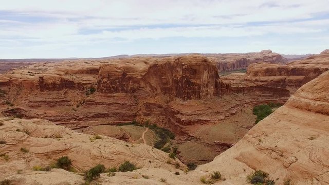 Reverse footage over summit in Moab