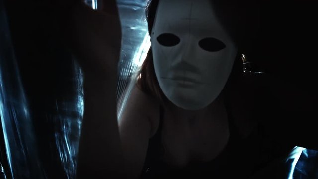 4K Horror Shot Of Woman in Mask Following Camera