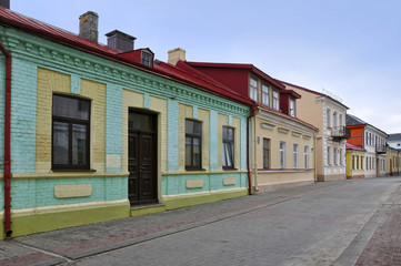 Old street of Grodno with colorful houses in perspective. Belarus.