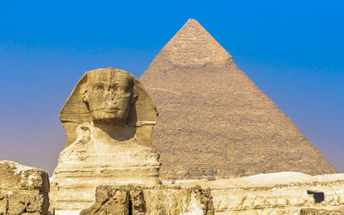 Fototapeta na wymiar Sphinx and pyramids at Giza, Cairo