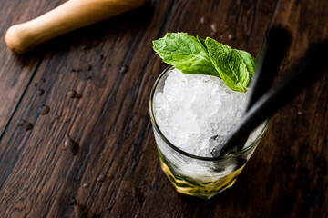 Mojito cocktail with lime, mint leaves and ice.
