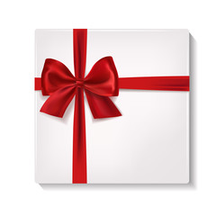Realistic white gift box with red satin ribbon and bow