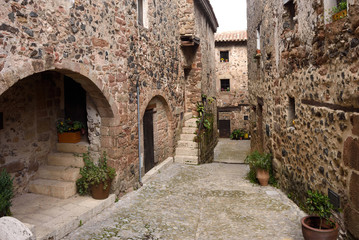 Fototapeta na wymiar Streets in the medieval village of Santa Pau, Garrotxa, Girona province, Catalonia, Spain