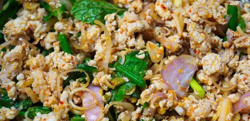 Chopped meat with chopped vegetables and chilies. Spicy minced pork salad. 