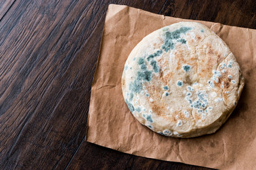 Moldy Bread on wooden surface
