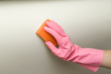 Leather area cleaning with sponge. Textile and leather sofa professionally chemical cleaning. Upholstered furniture. Early spring cleaning or regular clean up.