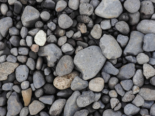 Various size of grey stones. Top view of grey stones floor.