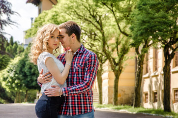 A young romantic couple in love in the city park.
