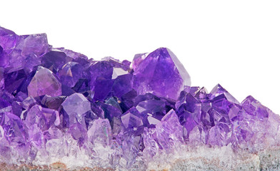 lilac amethyst crystals close-up on white