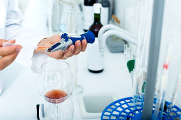 Wine being checked on component saturation in laboratory