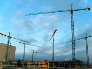 Fototapeta na wymiar Cranes on construction site in Santander, Spain