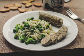  Homemade sausages with pasta and vegetables (broccoli and green peas)