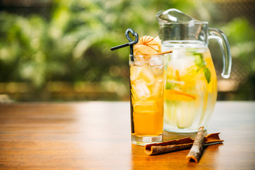 Refreshing cocktail with apple and jag with lemonade on a table in the restaurant