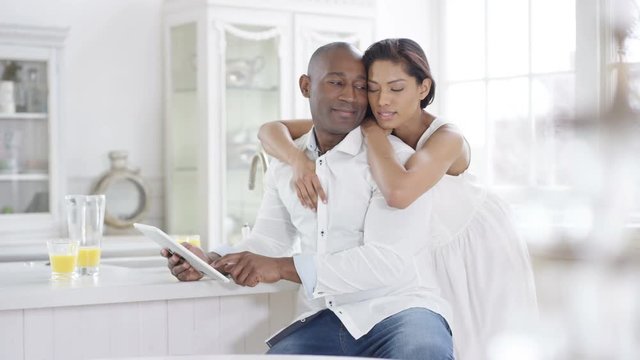 Happy romantic couple relaxing in apartment