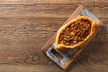Turkish pide pizza with meat and cheese.