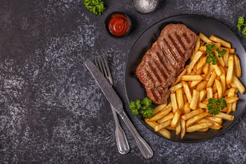 Beef barbecue steak with french fries.