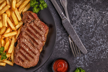 Beef barbecue steak with french fries.