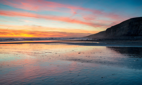 Sunset over the beach at Dunraven Bay