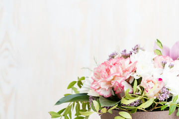 bouquet of flowers on a white wooden background. Copy space