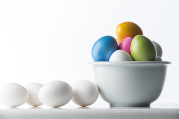 Colored eggs on the white background