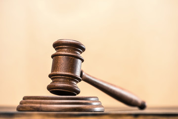 Close-up view of brown wooden mallet of judge, law concept
