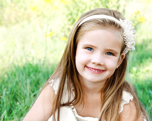 Fototapeta premium Cute happy little girl on the meadow